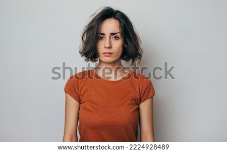 Close up shot of screaming crazy frustrated woman with anxiety, anger and depression. Very upset and emotional woman crying. Young girl with angry and furious face. Human expressions and emotions Royalty-Free Stock Photo #2224928489