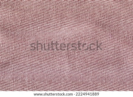 Light pink textured fabric with curves. High quality stock photo.