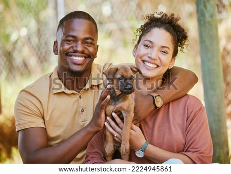 Love, portrait and black couple with dog at animal shelter for adoption at kennel. Support, care or happy interracial couple, man and woman bonding with foster puppy or pet and enjoying time together Royalty-Free Stock Photo #2224945861