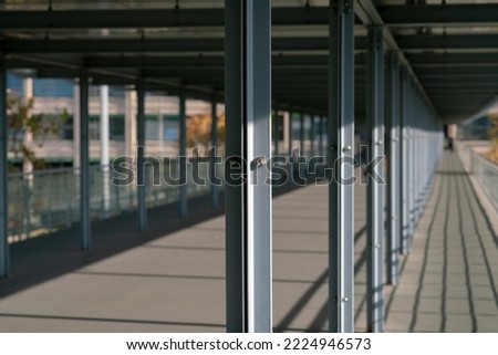 Architecture, special construction with steel beams, bolts and clamping nuts. Steel pillars formed by L-shaped sections joined by bolts Royalty-Free Stock Photo #2224946573