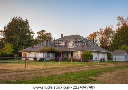 Big family house built on farm land. Image of residential house. Typical North American Country Farm House. Travel photo, selective focus, nobody
