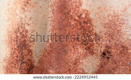Take close-up shot with the rusty iron background. Abstract metal texture concept surface painted old red.