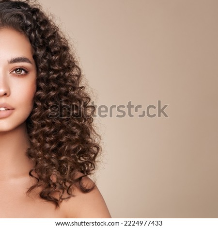Fashion studio portrait of beautiful woman with afro curls hairstyle. Facial treatment. Cosmetology, beauty and spa Royalty-Free Stock Photo #2224977433