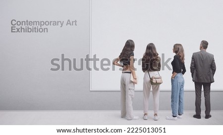 People at the contemporary art exhibition, they are looking at one artwork, blank copy space Royalty-Free Stock Photo #2225013051
