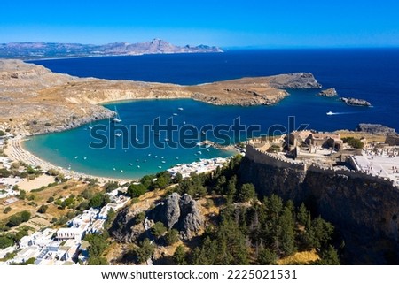 Aerial view of the famouse tourist destination in rhodes island. Village Lindos, with the acropolis and the aegan sea. Dodecanese, Greece.
