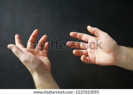 Male hands on a gray background. Finger gestures. Gesticulation hands. Royalty-Free Stock Photo #2225023095