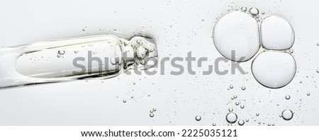 The texture of a cosmetic serum with a pipette closeup. Macrophotography Royalty-Free Stock Photo #2225035121