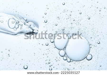 The texture of a cosmetic serum with a pipette closeup. Macrophotography Royalty-Free Stock Photo #2225035127