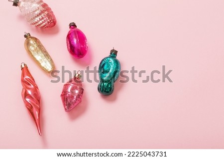vintage glass christmas toys on pink background
