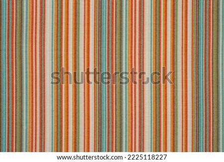 Multi colored fabric placemat, with vertical lines, Abstract close up backdrop Royalty-Free Stock Photo #2225118227