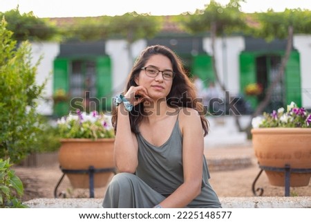 Happy young woman on a farm in the countryside 