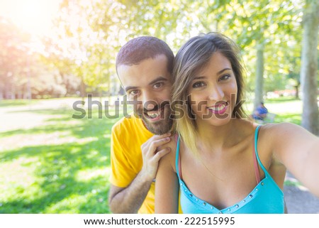 Young Couple Taking Selfie at Park