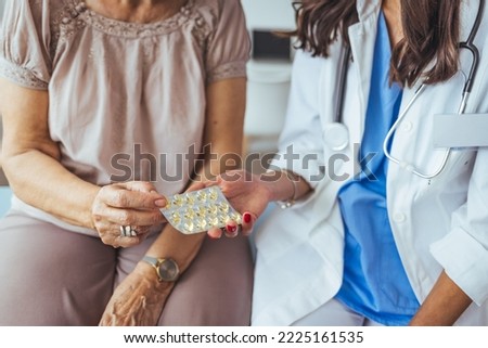 Doctor or physician recommend pills medical prescription to senior female Patient hospital and medicine concept. Senior woman at the doctor. Doctor consulting female patient about pills 