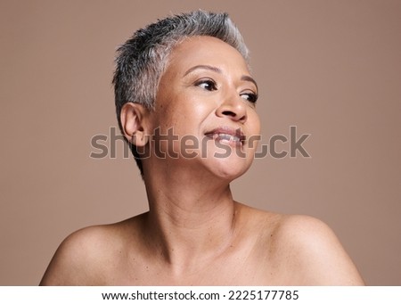 Black woman, senior skincare and beauty while in studio for cosmetics, makeup and dermatology mockup for health and wellness. Face of a model on brown background with natural, healthy and clear, skin Royalty-Free Stock Photo #2225177785