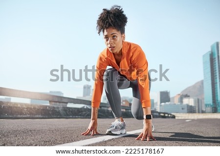 Runner, black woman and street for race, start or sprint in exercise, workout and training in city. Woman, focus and running for fitness, sport and health on road, metro or urban town in sunshine