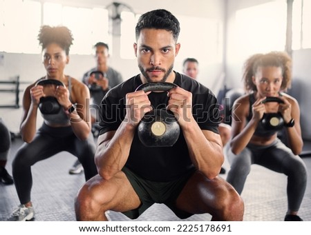 Kettlebell, workout and fitness class with a gym coach and people training with cardio and exercise. Portrait of a strong personal trainer and sports friends in a wellness health club with motivation Royalty-Free Stock Photo #2225178691