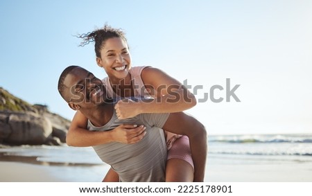 Fun, black couple and piggyback with happy people on vacation playing and being silly while having fun. Holiday, getaway and african girlfriend and boyfriend play whole being carefree by the sea Royalty-Free Stock Photo #2225178901