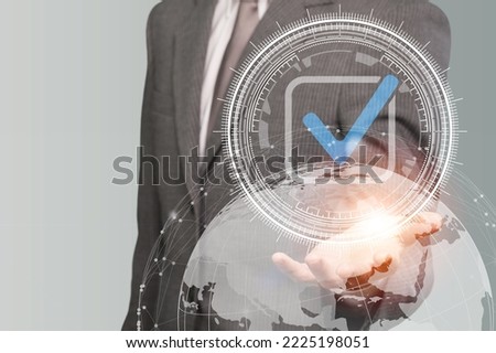 Happy young business man pointing with finger