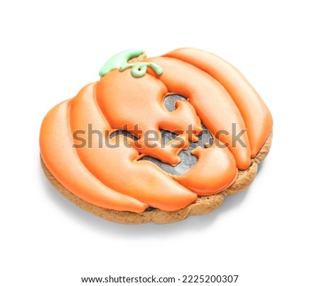 Halloween pumpkin cookie on white background