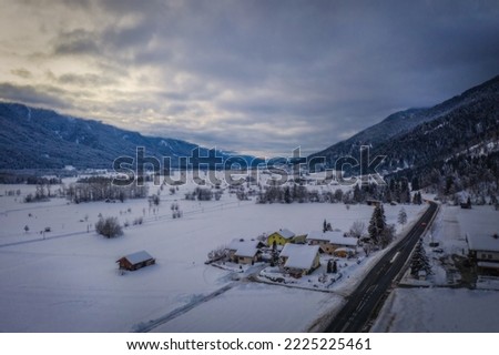 Panoramic view of the top of Waidegg near Tressdorf on the border between Italy and Austria. Nassfeld ski resort in 5km. January 2022, drone aerial shot.