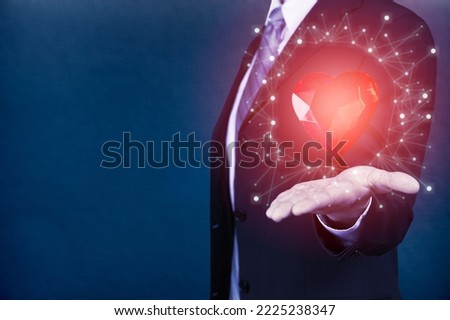 Business man with digital heart image