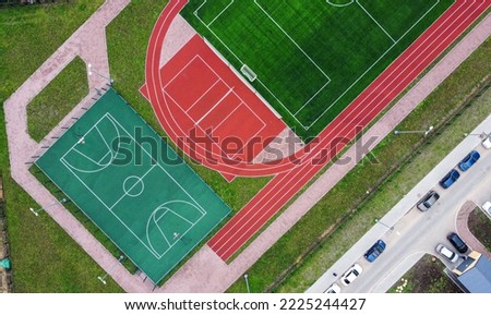 Aerial view of empty tennis courts and soccer field Royalty-Free Stock Photo #2225244427