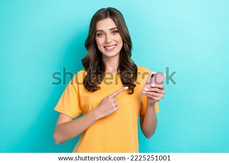 Photo of positive cool lady arm demonstrate direct gadget offer device shop sale discount empty space isolated on cyan color background