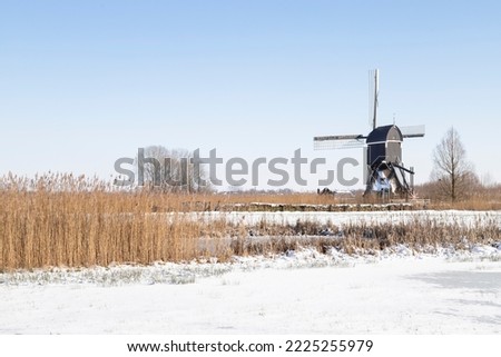 Windmill built in 1683 -  Oudendijkse molen, in the Dutch winter landscape.