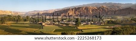 Afghanistan, Bamiyan (Bamian or Bamyan), cultural landscape and archeological remains, UNESCO World Heritage, panoramical view of the valley, town and empty niches where Buddha statues were destroyed Royalty-Free Stock Photo #2225268173