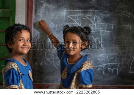 School Children's writing on blackboard at school Royalty-Free Stock Photo #2225282805