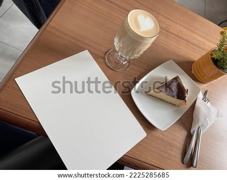 Blank blank white sheet of paper on coffee table template for design work freelance