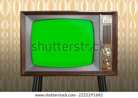 old retro analog TV in room with old fashioned wallpaper, red button, blank screen for designer with copy space, 1960-1970, concept modernization or technological revolution, mockup, template Royalty-Free Stock Photo #2225291681