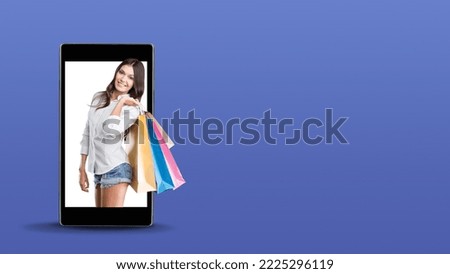 Happy woman with set of bags on the smartphone screen