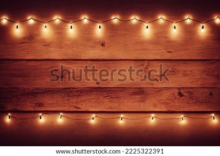 Old vintage wooden plank with Christmas lights