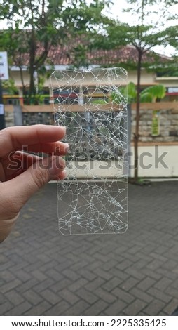 Broken screen protector on smartphone