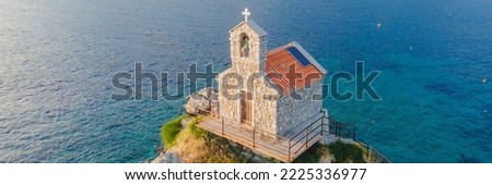 BANNER, LONG FORMAT Sveta Nedelja is an islet on the Adriatic Sea, in Montenegrin municipality of Budva. It is located opposite the town of Petrovac na Moru in Montenegro. It has a small church on it