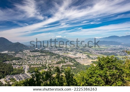 Stunning view of the city of Chilliwack in the Fraser Valley, BC, from the summit of Mount Thom on a beautiful summer day. Royalty-Free Stock Photo #2225386263