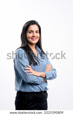 Young indian businesswoman or employee standing on white background. Royalty-Free Stock Photo #2225390809