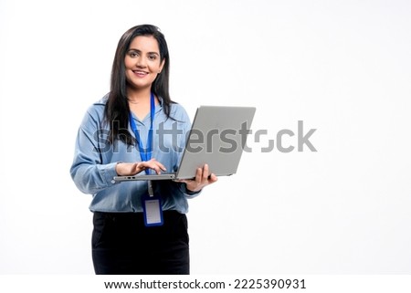Indian businesswoman or employee using laptop on white background.
