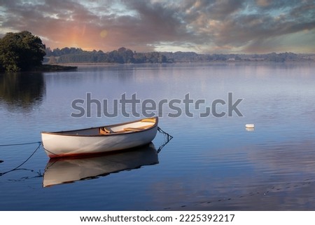 Lake of Sjaelso and boat in Denmark in Autumn Royalty-Free Stock Photo #2225392217