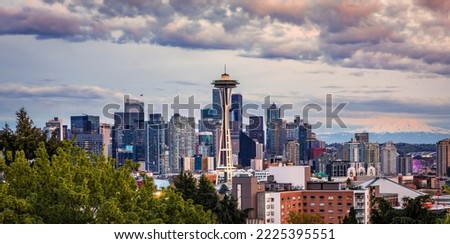 Downtown city skyline panoramic view with skyscrapers and Mount Rainier at sunset from Kerry Park in Seattle, Washington