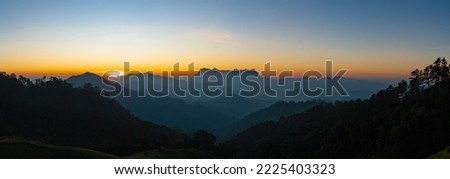 A beautiful Mountain named Doi Luang Chiang Dao mountain taken from Hadubi hill in Chiang Mai province of Thailand in the morning. Panorama image.
