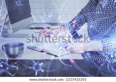 Neuron hologram with man working on computer on background. Education concept. Double exposure.