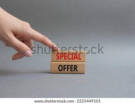 Special offer symbol. Concept word Special offer on wooden blocks. Beautiful grey background. Businessman hand. Business and Special offer concept. Copy space