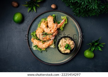 Deep fried almond shrimp tempura on plate, restaurant seafood, Ebi Tempura shrimp and almond Thai food. Asian food fried shrimp in almond flakes. Horizontal orientation, top view. Royalty-Free Stock Photo #2225454297