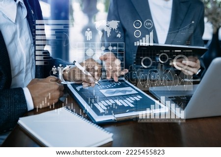 Financial report data of business operations balance sheet and income statement and diagram as Fintech concept.Business team meeting. digital tablet and laptop.

