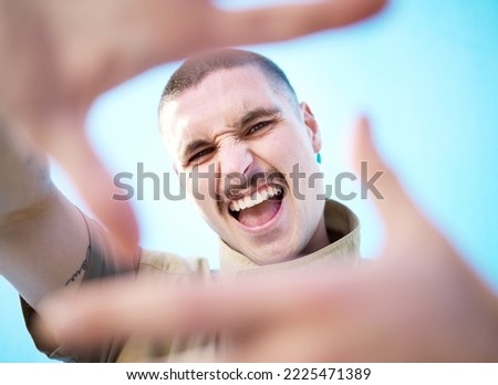 Face hands frame, smile and man portrait feeling happy about beauty, fashion and skincare. Smile, comedy and silly gen z model with a aesthetic hand sign feeling happiness, creativity and funny
