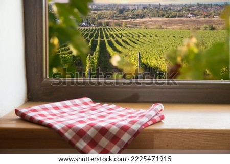 Red wine with barrel on vineyard in green Tuscany, Italy. High quality photo
