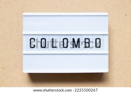 Lightbox with word colombo on wood background