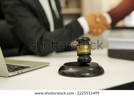 judge on wooden table And experienced lawyers meet with clients and give advice behind the scenes. legal services legal consulting concept